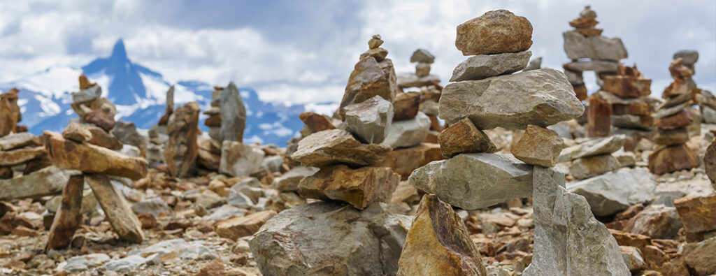 Inukshuks built by hikers on top of Cougar Mountain, a summer activity destination.